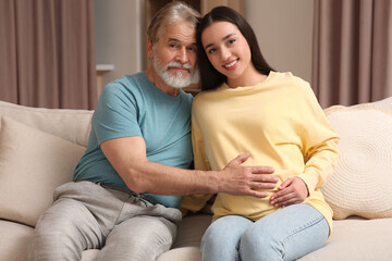 Poster - Father and his pregnant daughter indoors. Grandparents' reaction to future grandson