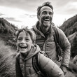 A portrait of a father and son hiking on a mountain