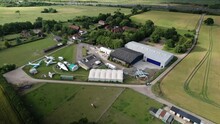 Aerial View Across De Havilland Mosquito And Vampire Preserved Aircraft Collection Outside Hertfordshire Museum Farmland 