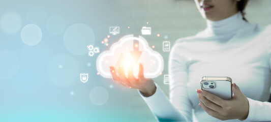Fototapete - Businesswoman using smartphone connecting big data from cloud server and holding cloud on virtual screen. Technology AR cloud computing.	
