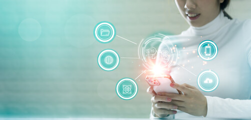 Fototapete - Technology concept. Woman using smartphone connecting chatting ai, cloud storage upload and download. Blue backgroundTechnology concept. Woman using smartphone connecting chatting ai, cloud storage up