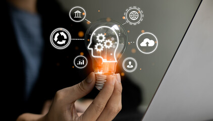 Fototapete - Businesswoman holding light bulb symbol of idea. Smart brain ai technology and cloud storage data.