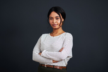 Serious, mockup and portrait of a black woman arms crossed isolated in a gray background studio ready for work. Proud, dark and African female person or professional confident and focus on job