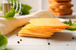 © Pixel-Shot - Slices of tasty processed cheese on table
