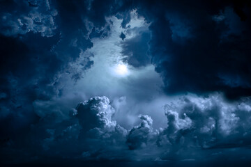 Wall Mural - night sky with moon light. dramatic clouds in mystic moonlight. large bright moon as concept of myst