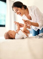 Poster - Happy, love and a mother with her baby on the bed in their home together for playful bonding. Family, children and a young mama spending time with her newborn infant in the bedroom for fun or joy