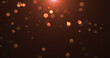 © Bolbik - Abstract background of yellow orange gold glowing particles and bokeh dots of festive energy magic