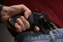 Man Pulling A Concealed .41 Magnum Pistol From His Waistband