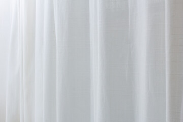 Wall Mural - A view of a sheer white curtain diffusing the exterior sunlight, as a background.