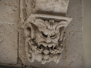 Wall Mural - balcony sculpture ortigia syracuse old buildings street view Sicily on sunny day