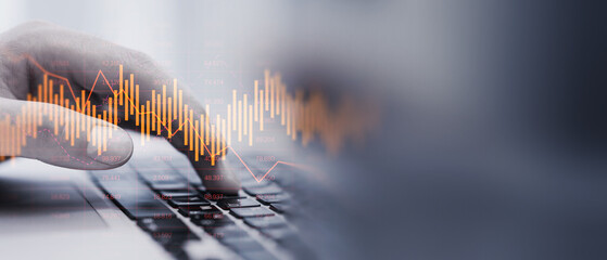Poster - Close up of man hand using laptop keyboard with glowing downward business chart on blurry wide perspective background with mock up place. Crisis and stock market recession concept. Double exposure.
