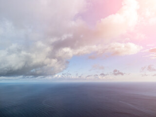 Wall Mural - aerial view. the drone flies over foggy and fluffy clouds. blue sky sun and sea fog. abstract aerial