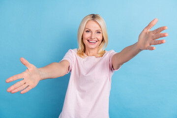 Sticker - Photo of sweet satisfied aged person raise opened arms invite welcome you isolated on blue color background