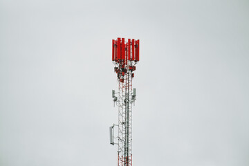 telecommunications tower of different mobile phone, radio and television operators with masts and microwave radio link antennas 4g and 5g feeder