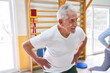 © Robert Kneschke - Smiling senior patients exercising at rehabilitation center
