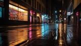 Fototapeta Londyn - a city street at night with brightly lit windows and a wet sidewalk