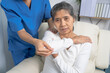 © M+Isolation+Photo - Female asian physiotherapist worker giving neck massage to mature woman, closeup. Rehabilitation physiotherapy in rehabilitation center, neck pain
