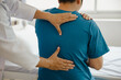 © Witoon - Doctor or Physiotherapist working examining treating injured arm of athlete male patient, stretching and exercise, Doing the Rehabilitation therapy pain in clinic.
