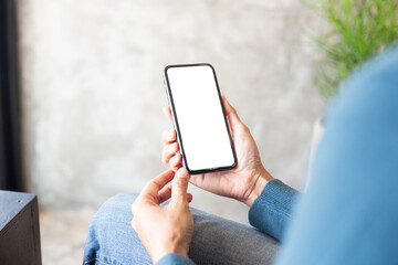 cell phone blank white screen mockup.hand holding texting using mobile on desk at office.background empty space for advertise.work people contact marketing business,technology