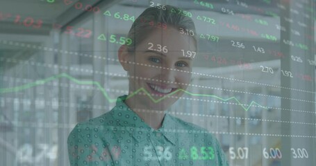 Wall Mural - Animation of stock market data processing against caucasian woman smiling at office