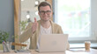 © stockbakers - Thumbs Up by Young Businessman on Laptop
