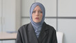 Portrait of Shocked Muslim Businesswoman Reacting to Loss