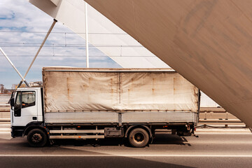 Transportation and logistics, old truck crossing the bridge