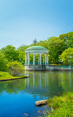 Wall Mural - Pavilion, trees, rock, and water reflections on the pond at Roger Williams Park in Providence, Rhode Island