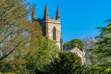 A view towards the church of Canons Ashby Priory, UK in summertime