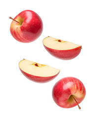 Wall Mural - Isolated flying apple wedges. Falling pieces of red apple fruit isolated on transparent background