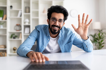 Poster - Online Communication. Young Smiling Indian Man Making Video Call On Laptop