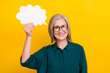 Sticker - Portrait of positive friendly person hand hold empty space cloud shape card isolated on yellow color background