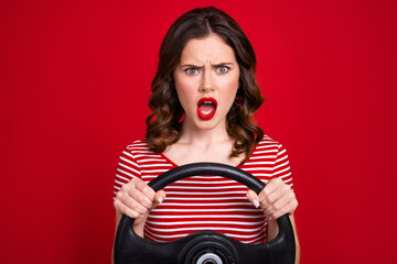 Sticker - Portrait of aggressive mad girl wear stylish clothes driving own car annoyed traffic jams isolated on red color background