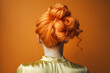 Orange colored hair in elegant updo hairstyle. 