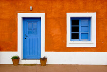 Beautiful And Funny Orange House With Blue Doors And Windows