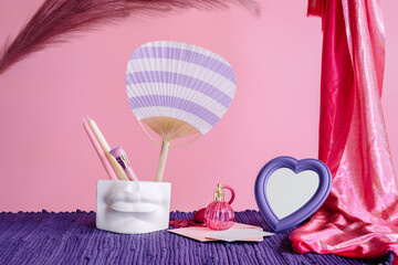 Composition of red fabric with decorative elements. Girl's stuff. 