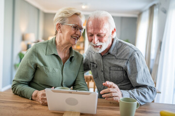 Wall Mural - senior couple man woman husband and wife use digital tablet video call