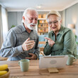 © Miljan Živković - senior couple man woman husband and wife use digital tablet video call