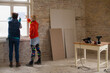 © Jelena Jojic Tomic/Stocksy - Friends are discussing the home renovation plan