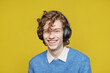 © Oleksii Syrotkin/Stocksy - Portrait music lover earphones studio pleasure