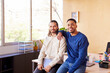 © ALTO IMAGES/Stocksy - Cheerful multiracial colleagues standing in office