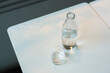 © Vradiy Art/Stocksy - Bottle of water and glass