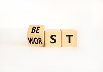 Best or worst symbol. Businessman turns wooden cubes and changes the word best to worst. Beautiful white table white background, copy space. Business and best or worst concept.