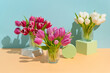 © Pixel Stories/Stocksy - Still life of Spring tulip flowers on colorful background and shapes