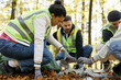 © Oleksii Syrotkin/Stocksy - Eco activism volunteering cleaning up teamwork garbage nature