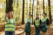 © Oleksii Syrotkin/Stocksy - Ecology teamwork volunteering nature smartphone photographing