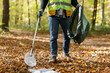 © Oleksii Syrotkin/Stocksy - unrecognizable volunteer forestpollution help plastic
