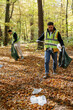 © Oleksii Syrotkin/Stocksy - activists teamwork tool nature litter outdoors