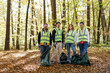 © Oleksii Syrotkin/Stocksy - volunteers clean up bags junk nature environmental issues