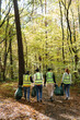 © Oleksii Syrotkin/Stocksy - Eco activists clean up trash recycling outdoors